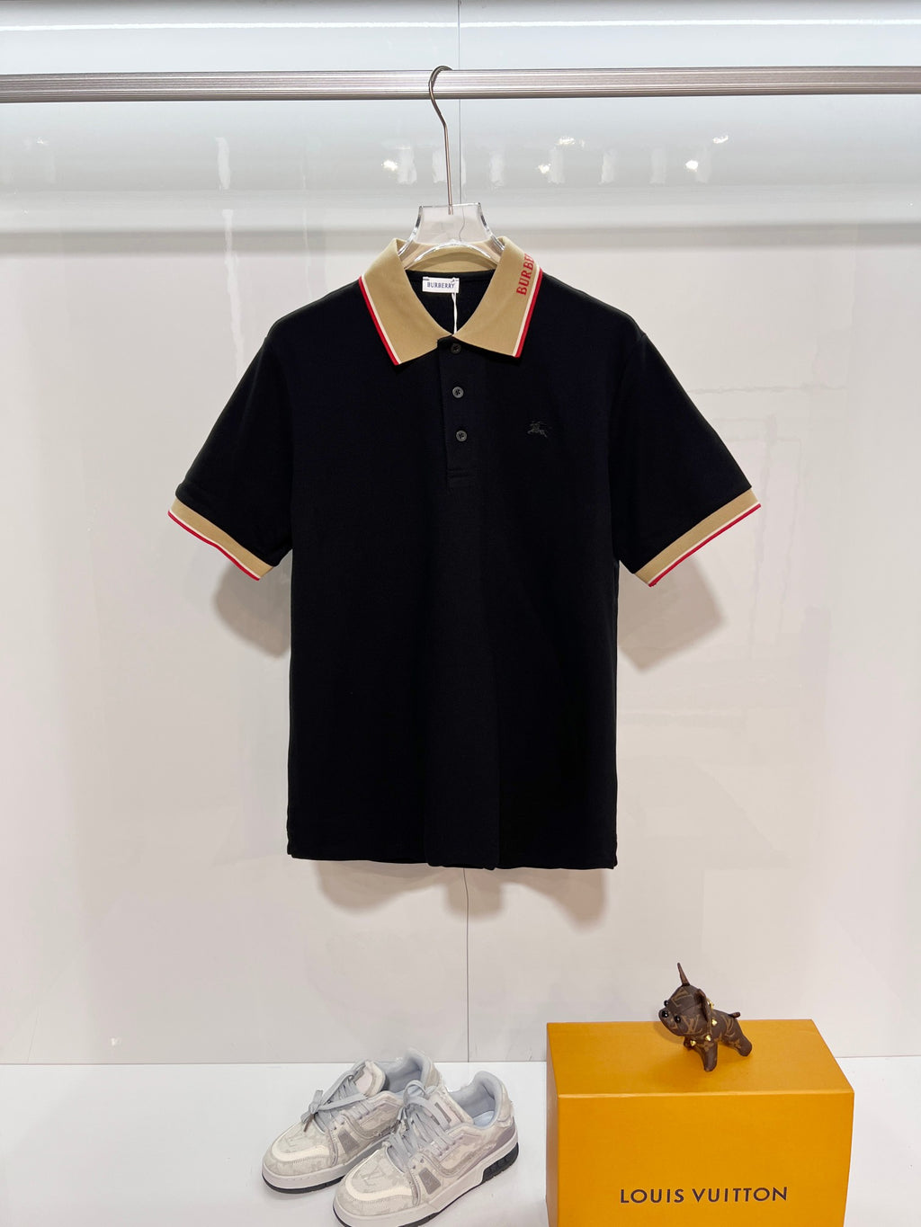Burberry polo shirt in dark navy with beige striped collar and three-button placket