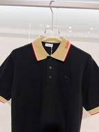 Burberry polo shirt in dark navy with beige pointed collar and buttoned placket
