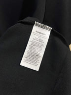 Burberry polo shirt care label on dark navy inner collar