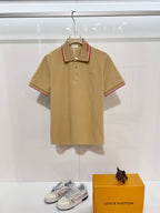 Burberry tan polo shirt with red-trim collar and button placket, small horse logo