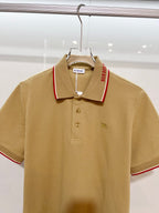 Tan Burberry polo shirt with red-trim collar, 3-button placket, horse logo