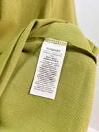Olive green polo care label at inner collar seam