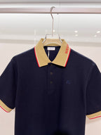 Navy Burberry polo shirt with contrast beige collar and red-trim stripe