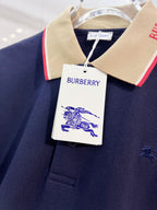 Burberry polo shirt with beige collar, red trim, and visible logo on chest