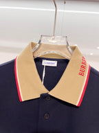 Dark blue Burberry polo shirt neckline with beige collar and red side stripe