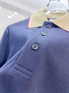 Dark blue Burberry polo shirt with three buttons and stitched placket detail