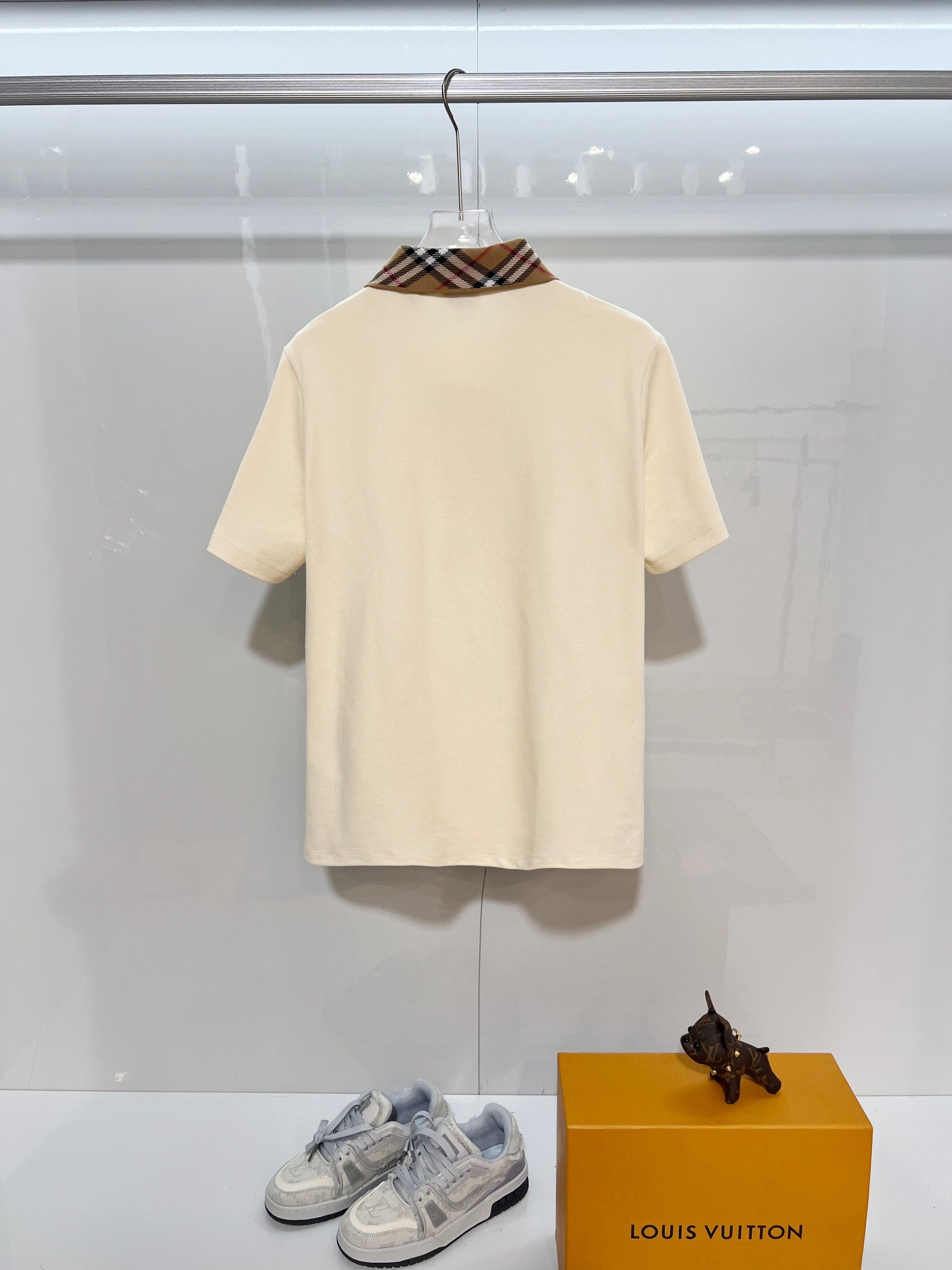 Cream short-sleeve polo shirt with check collar, back view