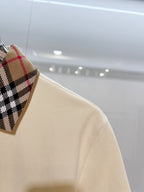 Cream short-sleeve polo shirt sleeve and check collar detail