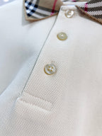 Cream polo shirt front with gold buttons and check collar corner