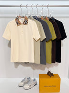 Short-sleeve polos on display: cream, navy, black, gray, and green with check collars