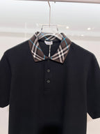 Black short-sleeve polo shirt with Burberry plaid pointed collar and button placket
