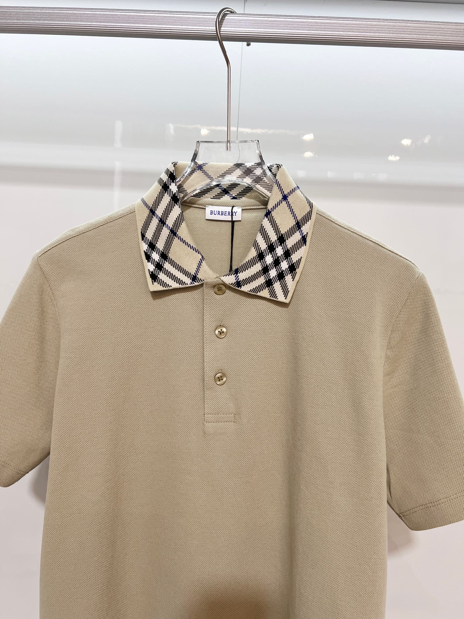 Beige Burberry polo shirt with checkered collar and three-button placket