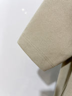 Beige polo shirt fabric with curved hemline