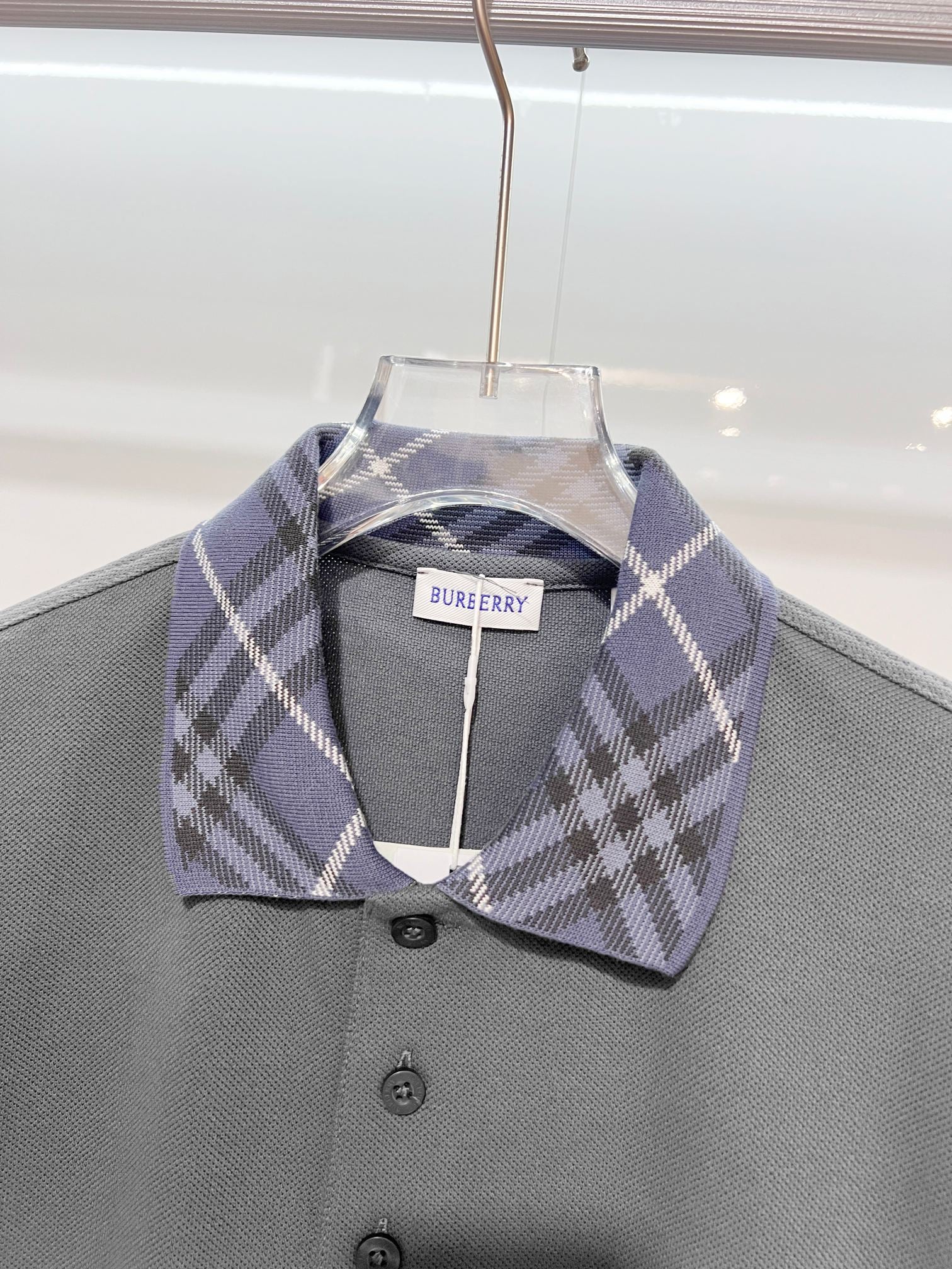 Mens polo shirt in dark gray with plaid collar and buttoned front