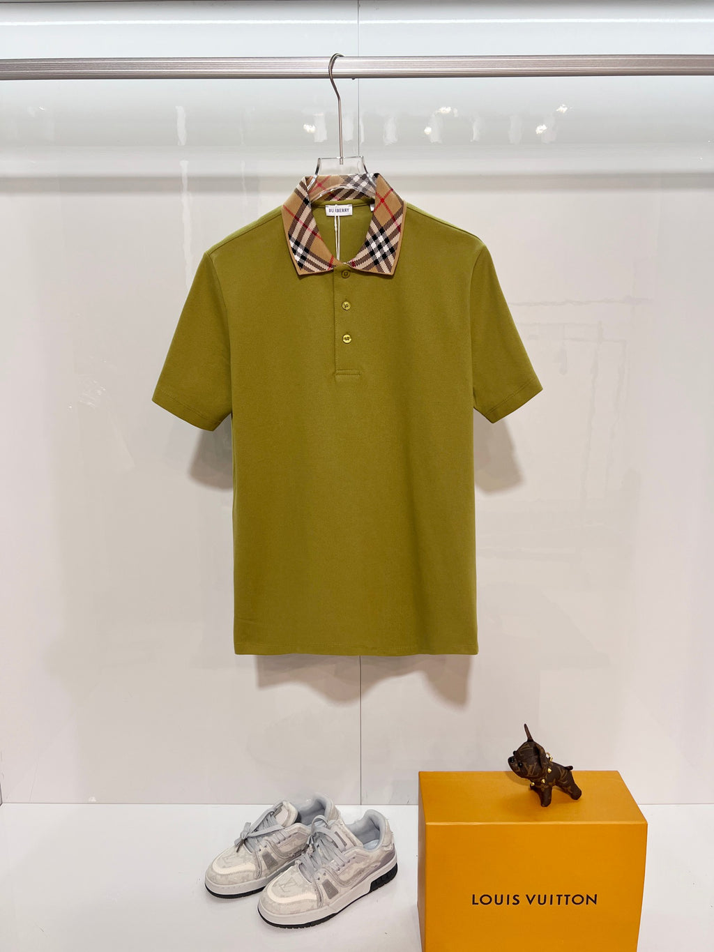 Olive green short-sleeve polo shirt with button placket and plaid check collar