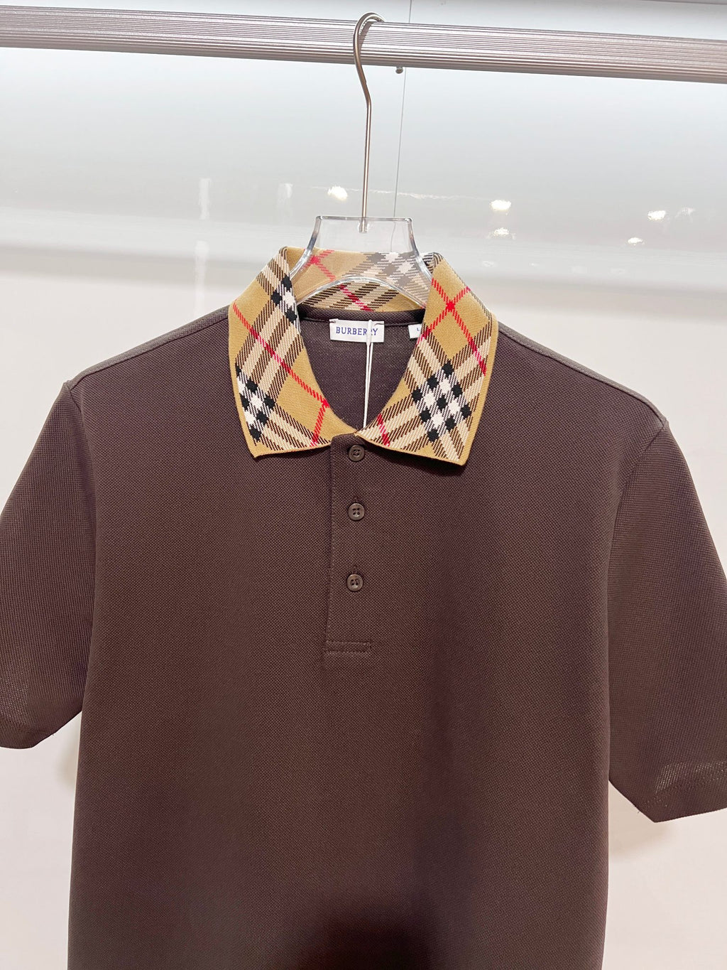 Burberry short-sleeve polo shirt, dark brown front with tartan check point collar