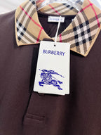Burberry polo collar in beige tartan with navy and red stripes; logo tag