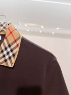 Burberry polo shirt, dark brown fabric with tartan collar corner on hanger