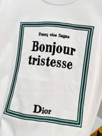 White Dior T-shirt with green-bordered “Bonjour tristesse” front graphic