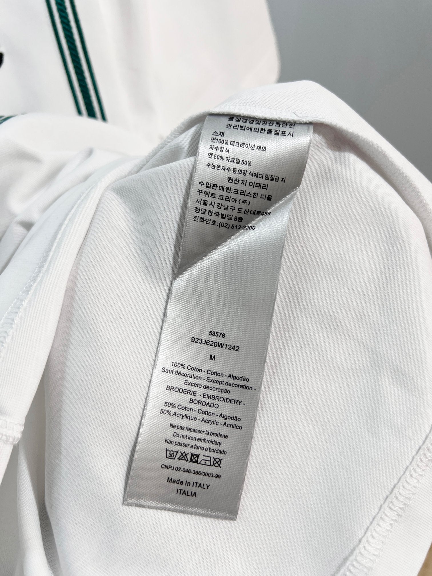 White Dior T-shirt care label tag sewn inside neck seam