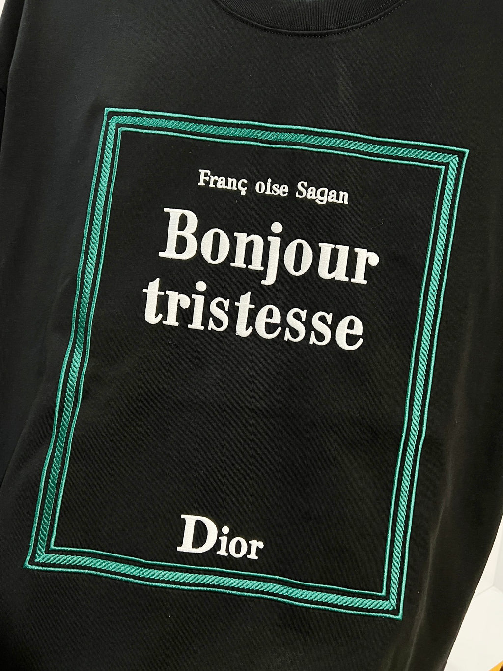 Black Dior T-shirt with 'Bonjour tristesse' square graphic in green border