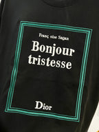 Black Dior T-shirt with 'Bonjour tristesse' square graphic in green border