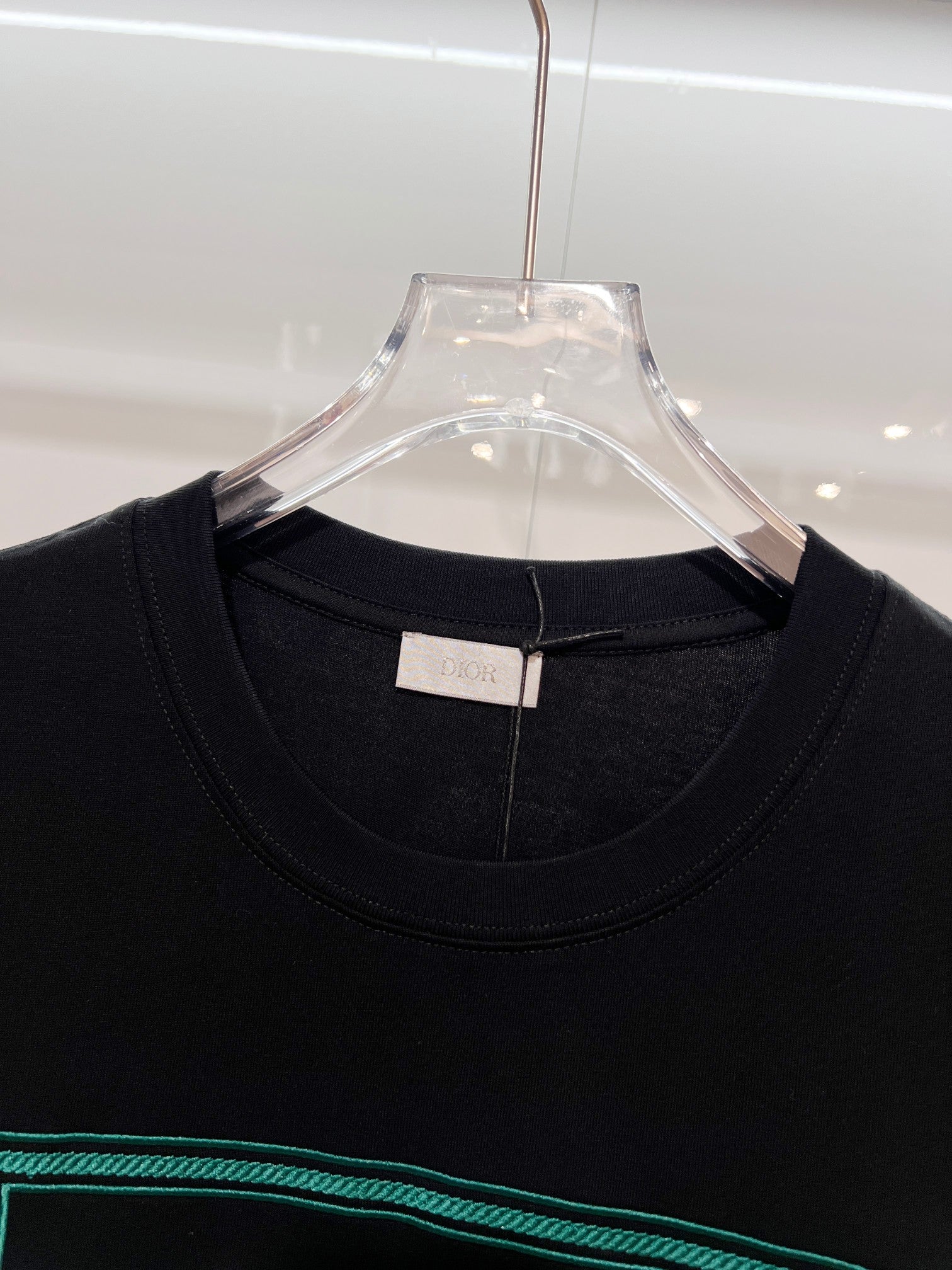 Black Dior T-shirt collar with brand label