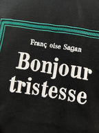 Black Dior T-shirt 'Bonjour tristesse' text graphic close-up