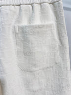 White shorts front pocket area with textured fabric pattern