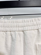 White shorts waistband with elastic gathers and drawstring channel