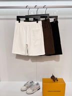Cotton shorts with elastic waistband, light beige, side pockets, on hangers