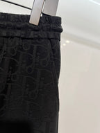 Black Dior monogram shorts on hanger with elastic waistband