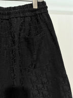 Black Dior monogram shorts with gathered elastic waist and side pleats