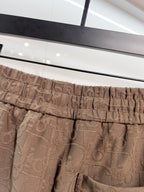 Dior logo-pattern drawstring shorts, brown elastic waistband and front pocket area