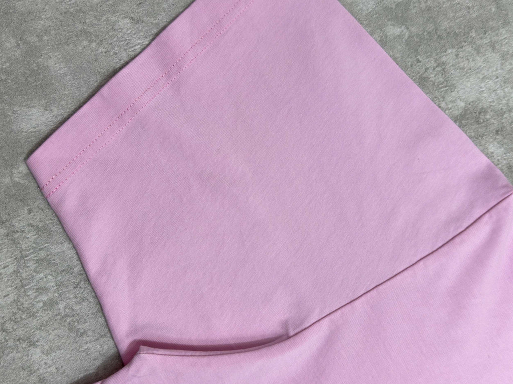 Balenciaga pink T-shirt hem and side seam close-up