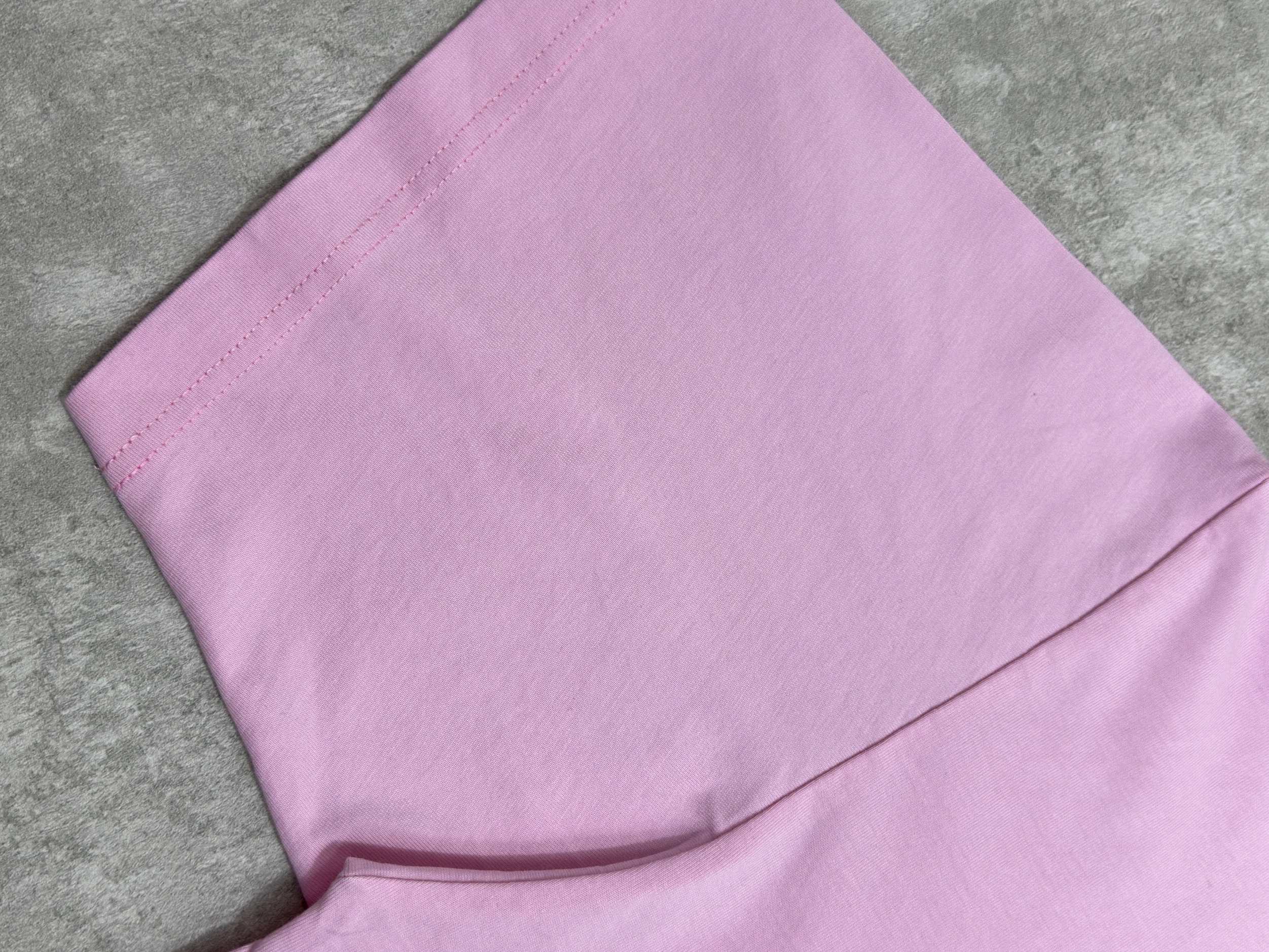 Balenciaga pink T-shirt hem and side seam close-up