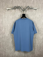 Balenciaga blue T-shirt on hanger, crew neck, short sleeves, plain back view