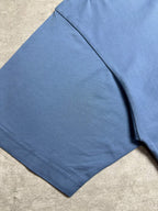 Balenciaga blue T-shirt side view close-up, short sleeves, smooth fabric fall