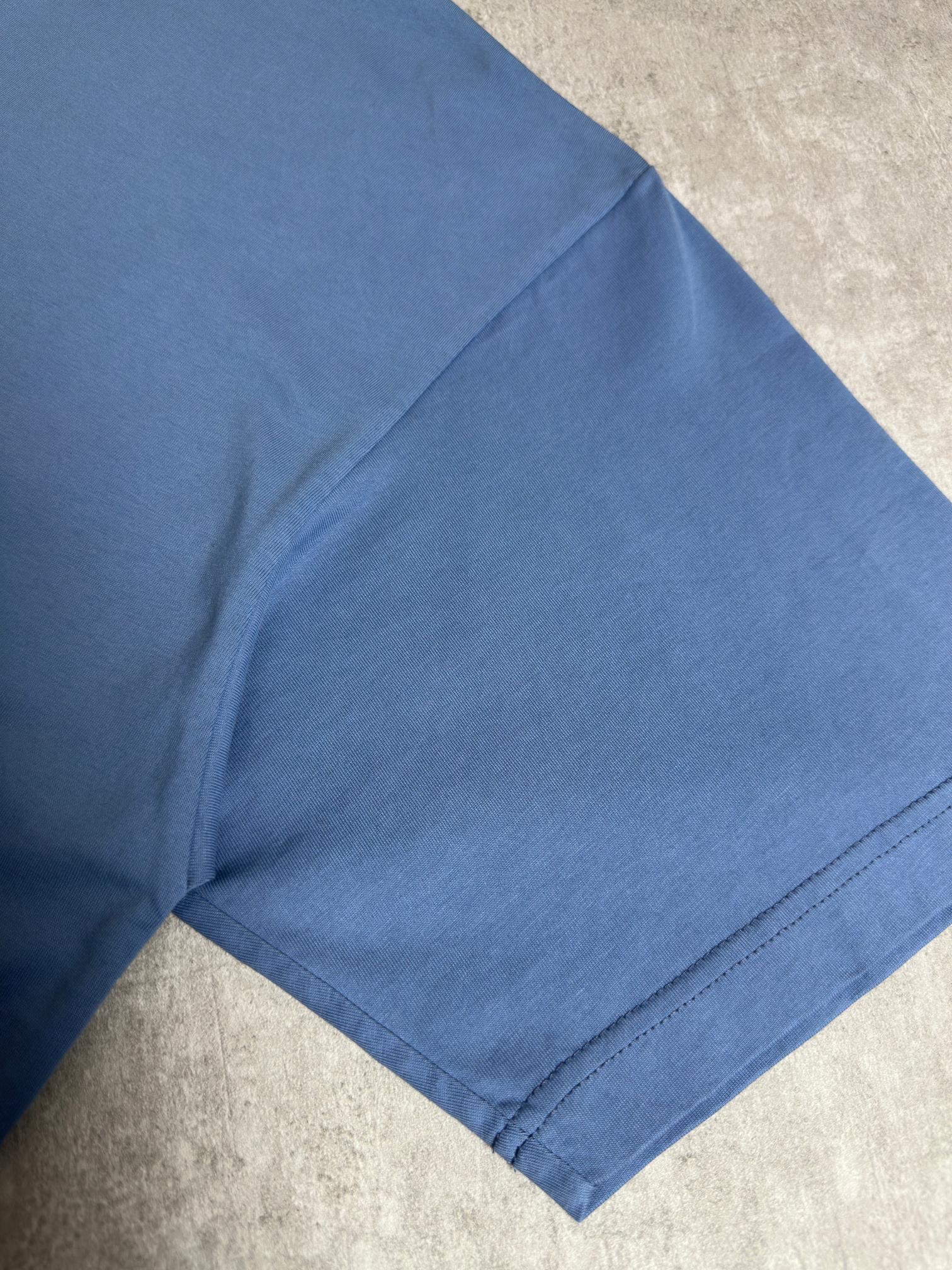 Balenciaga blue T-shirt sleeve and hem close-up, short sleeves, clean stitching