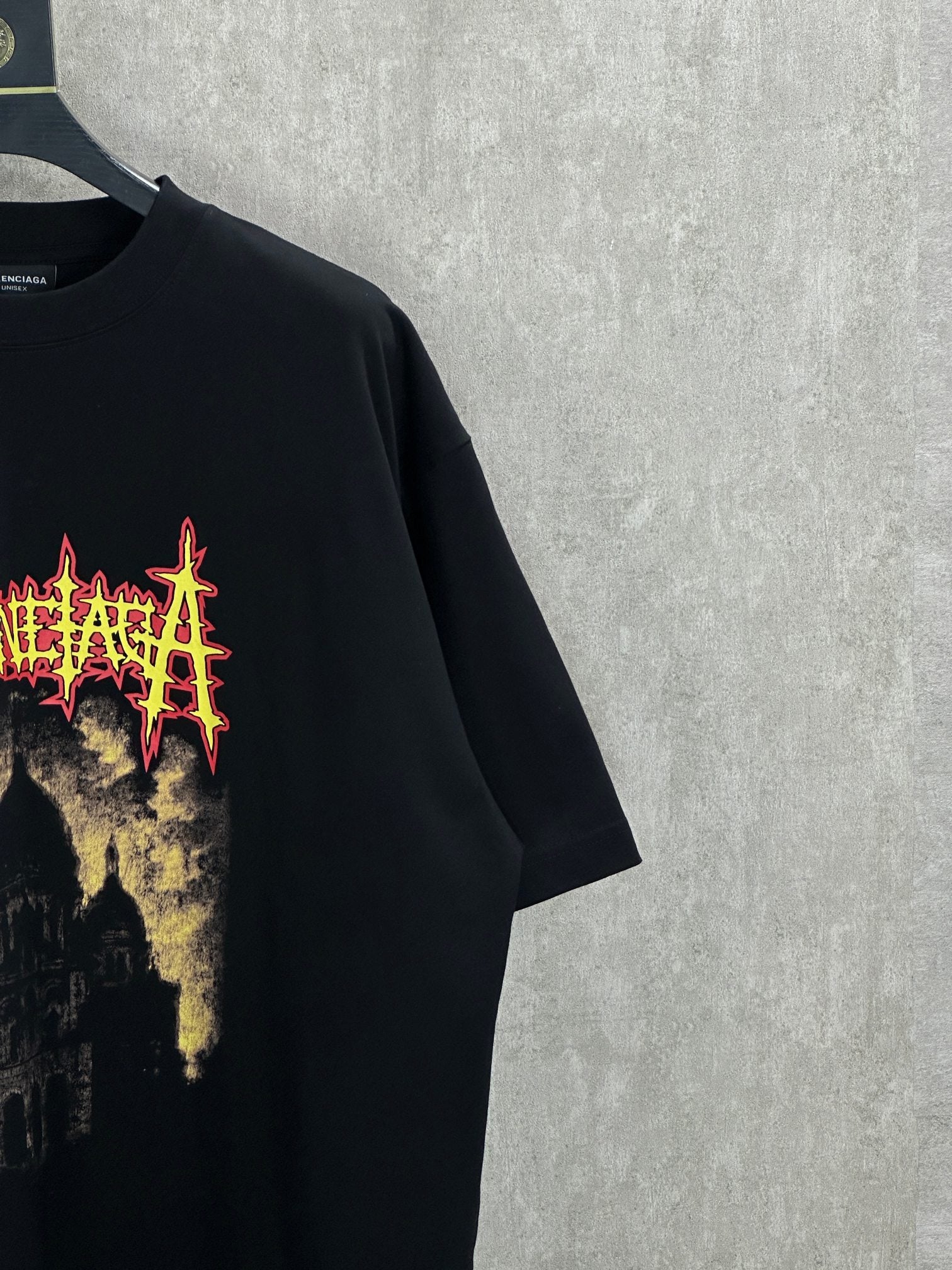 Balenciaga black short-sleeve shirt close-up of front graphic on the chest