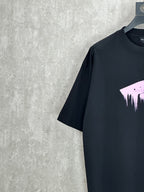 Balenciaga black crewneck T-shirt with partial purple dripping graphic on chest