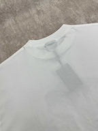 White T-shirt back close-up showing crew neck seam and relaxed fit