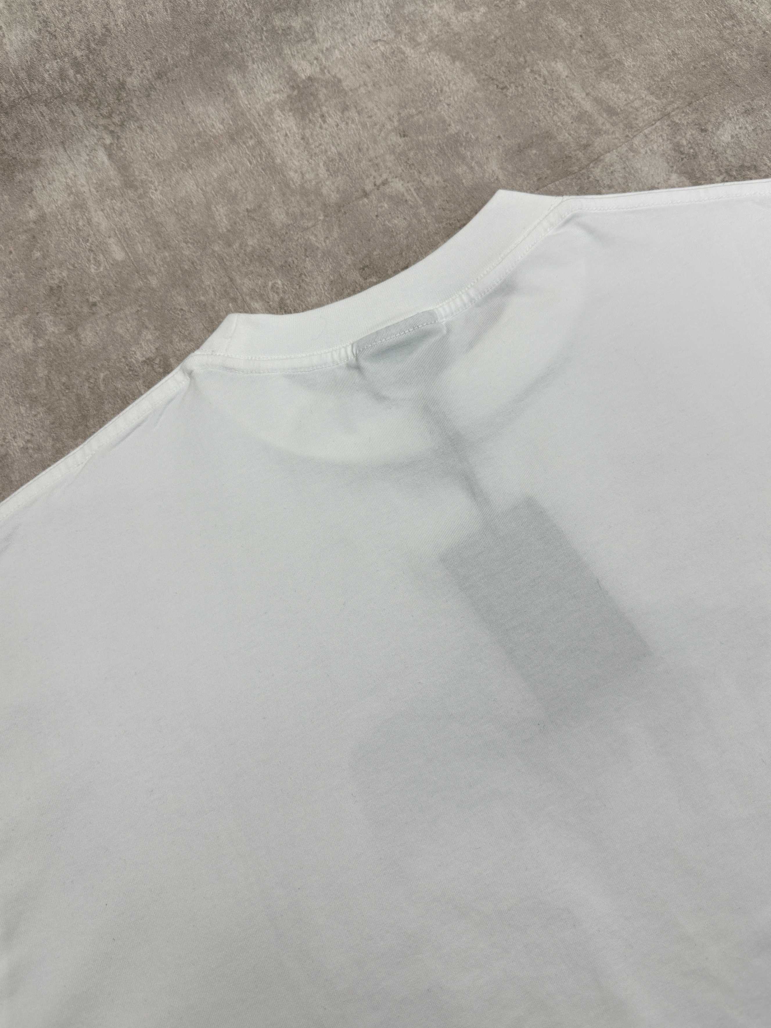 White T-shirt back close-up showing crew neck seam and relaxed fit