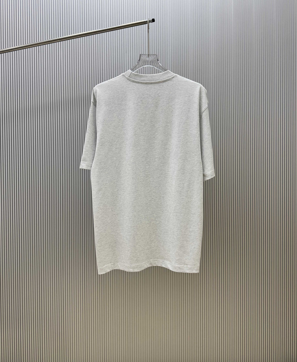 Light gray Givenchy crewneck T-shirt, back view on hanger