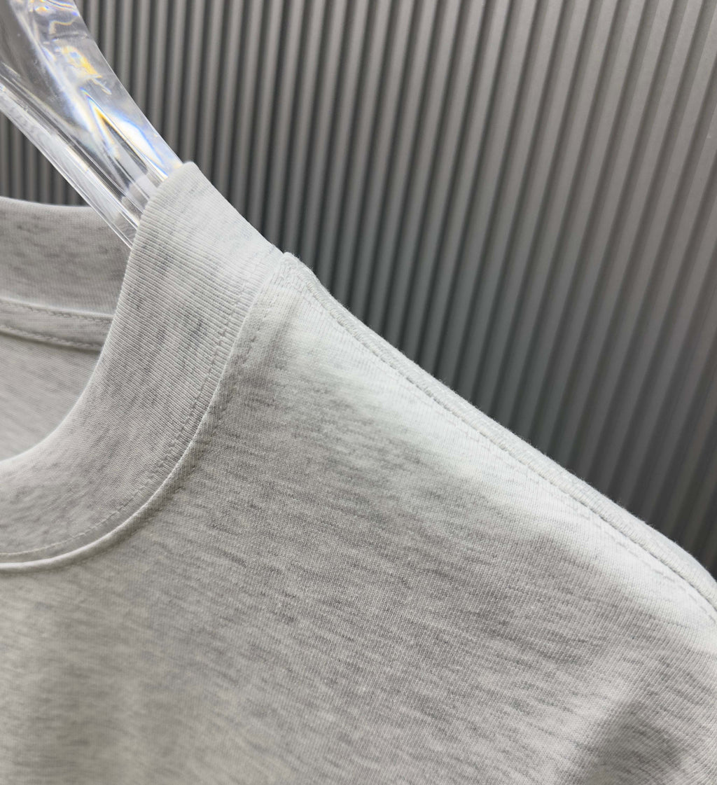 Light gray Givenchy T-shirt fabric close-up at side seam