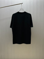 Black crew-neck short-sleeve T-shirt on a hanger