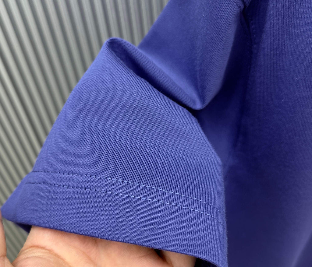 Blue Givenchy T-shirt sleeve cuff hem close-up