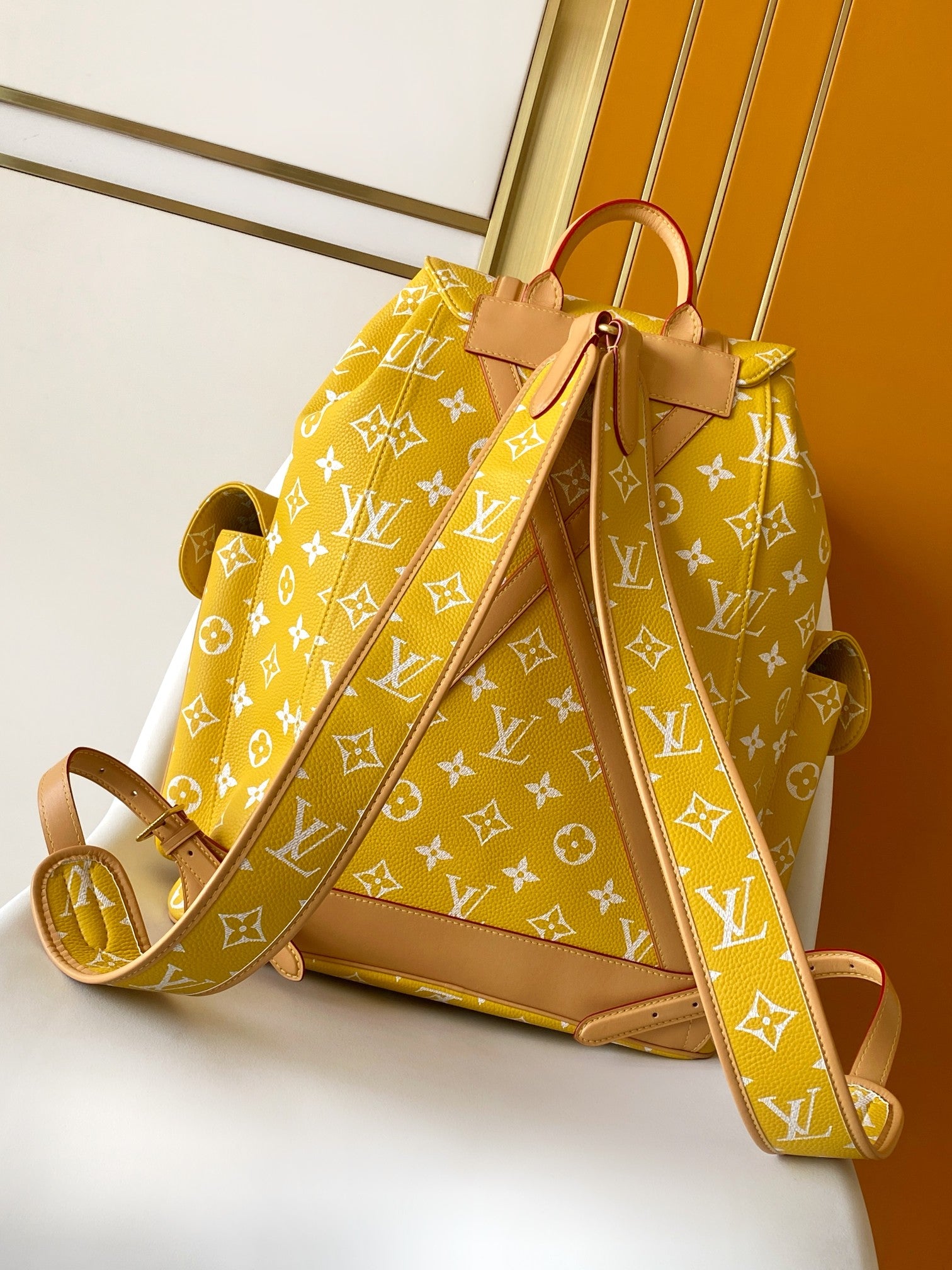 Louis Vuitton yellow monogram backpack bag with front strap and brown leather trim