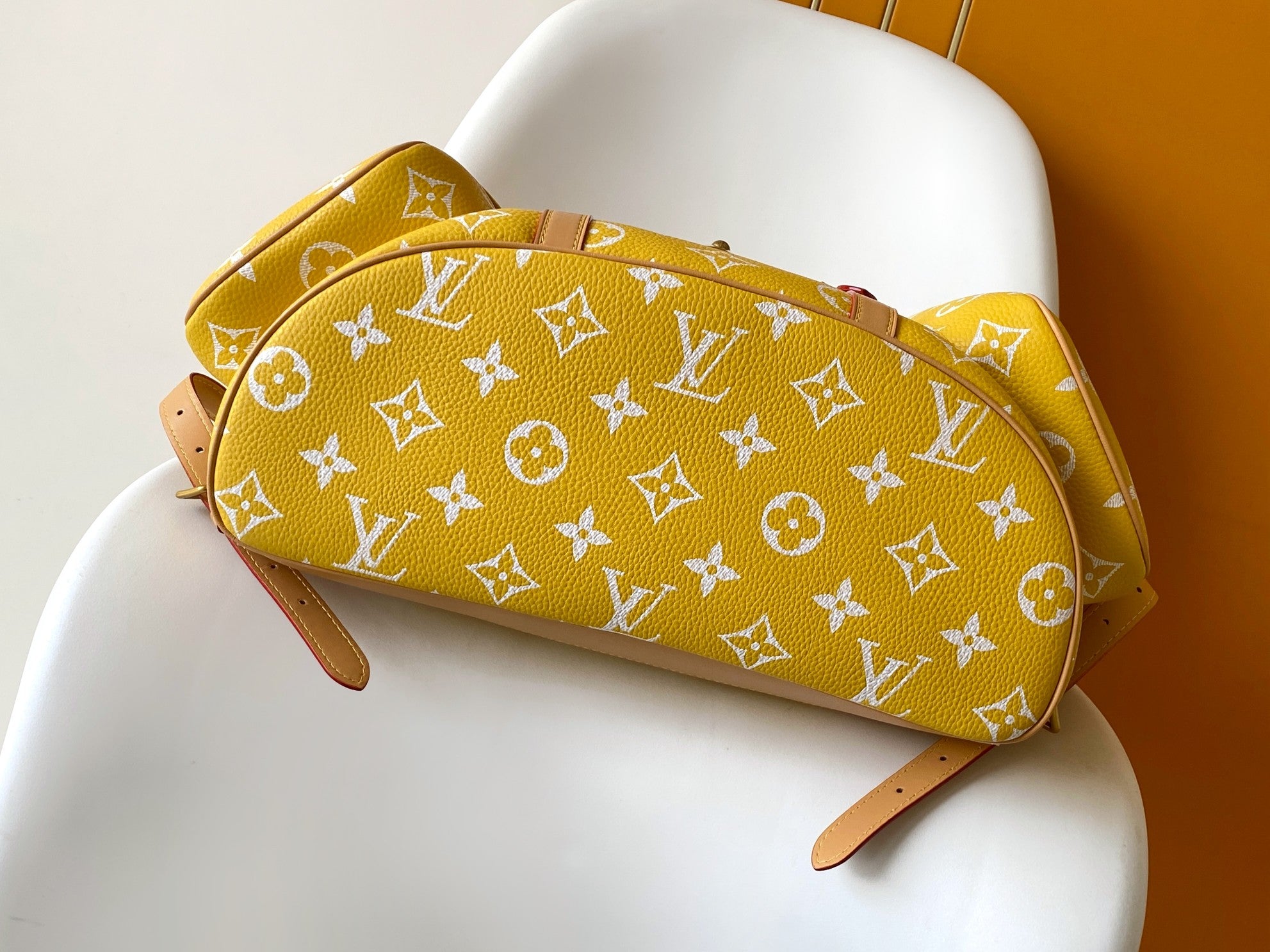 Louis Vuitton yellow monogram pouch bag with tan leather trim and side shoulder strap