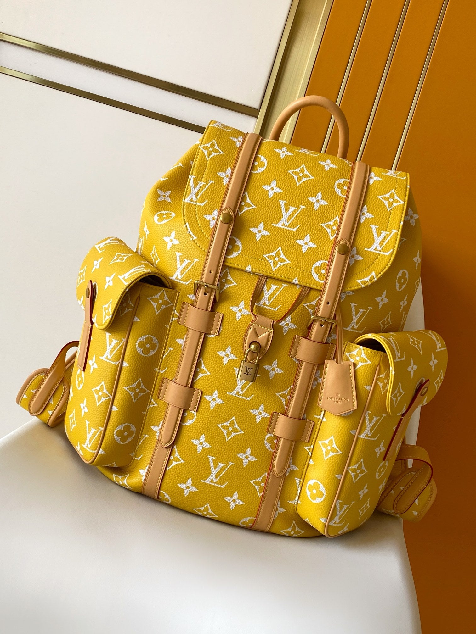 Louis Vuitton yellow monogram tote bag with brown leather handles and zip closure